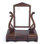 A REGENCY MAHOGANY DRESSING TABLE MIRROR the rectangular mirror plate with scrolling supports and