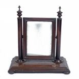 A VICTORIAN MAHOGANY SWING DRESSING TABLE MIRROR the rectangular mirror on two turned supports