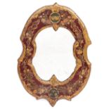 AN ANTIQUE WALL MIRROR with painted embossed leather mounted frame decorated with coronet, floral