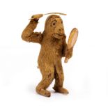 AN AUTOMATION PLUSH COVERED MONKEY TOY a monkey combing his hair, 12cm high Condition: the plastic