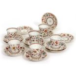 A PART SET OF CONTINENTAL PORCELAIN COFFEE CUPS AND SAUCERS circa. 1900, each with floral decoration