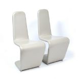 A PAIR OF MODERNIST GREY LEATHERETTE UPHOLSTERED SERPENTINE SIDE CHAIRS 48cm wide x 97cm high (2) At