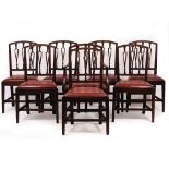 A SET OF EIGHT EARLY 19TH CENTURY MAHOGANY DINING CHAIRS with vertical splats, inset leather seats