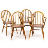 A SET OF FOUR LIGHT ELM ERCOL KITCHEN CHAIRS with spindle backs and turned supports (two carvers) At