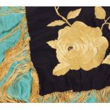 AN ORIENTAL GREEN SILK SHAWL with tassels and embroidered with flowers, 163cm x 145cm; a black and