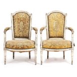 A PAIR OF LOUIS XVI STYLE PAINTED BEECHWOOD ARMCHAIRS with overstuffed upholstered backs, arms and