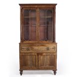 A WILLIAM IV MAHOGANY SECRETAIRE BOOKCASE with glazed doors, having reeded pilaster columns above