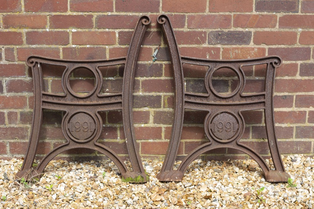 A PAIR OF 'STREET MASTER' CAST IRON BENCH ENDS each with a roundel bearing the date 1991 and each - Image 3 of 3