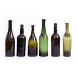 SIX ANTIQUE GLASS BOTTLES three with seals, the largest 33.5cm high Condition: overall good with