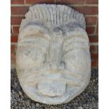 A MALAYSIAN STYLE CAST MASK of a god, 58cm wide x 72cm high Condition: of recent manufacture and