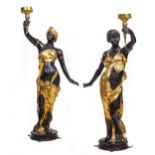 A PAIR OF CAST BRONZE FIGURAL FLOOR LAMPS each in the form of young women holding a torchiere aloft,