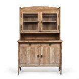 AN EARLY 20TH CENTURY CONTINENTAL PINE DRESSER with glazed doors above and two drawers and cupboards