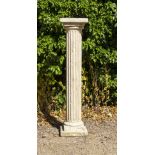 A CAST RECONSTITUTED STONE COLUMN OR SCULPTURE STAND with fluted shaft, 26cm square at the top and