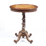 A VICTORIAN SATINWOOD OVAL OCCASIONAL TABLE with carved frieze, barley twist column support and four