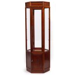 AN ORIENTAL HARDWOOD HEXAGONAL FLOOR STANDING DISPLAY CABINET with glazed sides, the panel base with