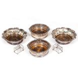 A PAIR OF HALLMARKED SILVER FOUR DIVISION MINIATURE TOAST RACKS each on ball feet, 7cm wide and