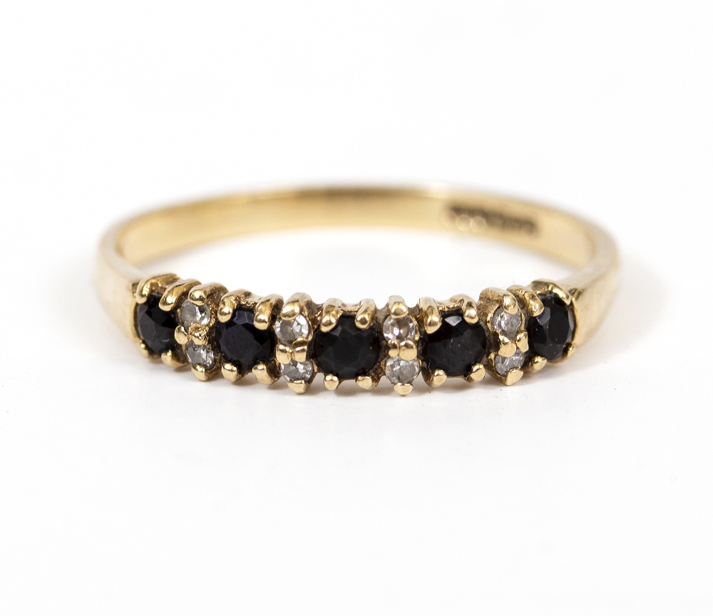 A 9 CARAT GOLD HALF ETERNITY RING Condition: good, needs cleaning
