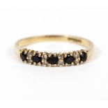 A 9 CARAT GOLD HALF ETERNITY RING Condition: good, needs cleaning