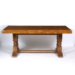 A PINE RECTANGULAR DINING TABLE with turned supports united by a stretcher, 90cm x 180cm x 76cm high