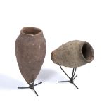TWO SIMILAR POTTERY CONICAL VESSELS of archaic form, the largest 28cm high and both with steel