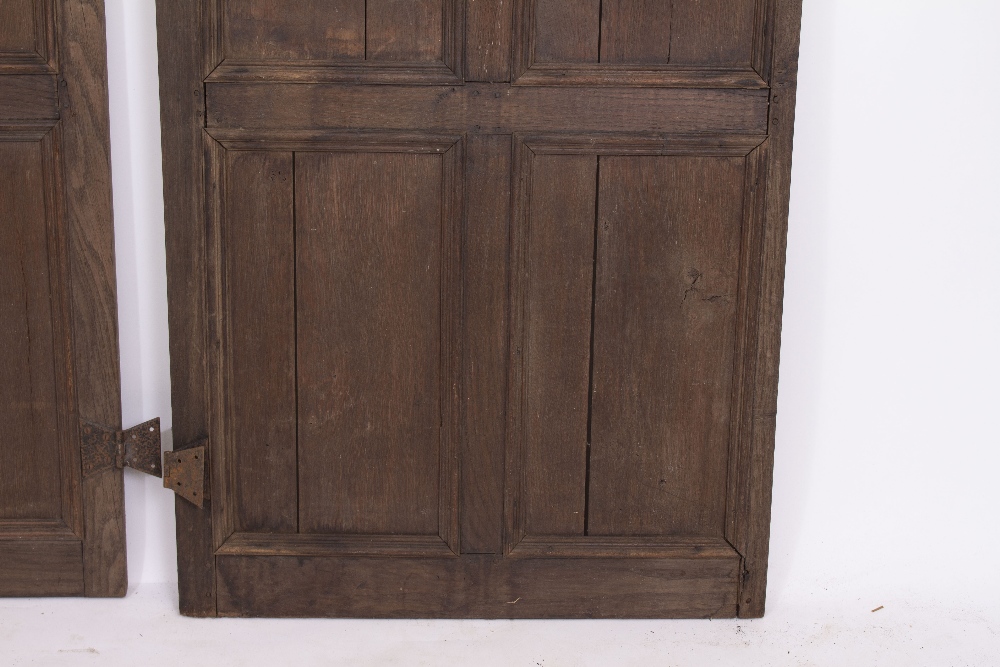 A PAIR OF OAK PANELLED DOORS with butterfly hinges, each door 70cm wide x 190.5cm high Condition: - Image 7 of 8