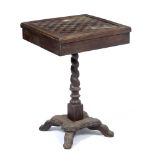 A 19TH CENTURY COLONIAL HARDWOOD GAMES TABLE the square top inlaid with checkerboard pattern, with