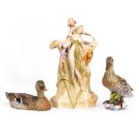 AN EARLY 20TH CENTURY ROYAL DUX PORCELAIN FIGURAL VASE of naturalistic form, adorned with semi-