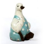 A FRENCH PAINTED ADVERTISING DUCK wearing white polka dot decorated dungarees, 58cm high At present,