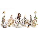 NINE CONTINENTAL PORCELAIN FIGURINES together with a pair of Capodimonte porcelain figural