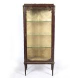 A CONTINENTAL VITRINE with marble top, bevelled glass to the door at the front and decorated with