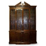 A GEORGE III STYLE MAHOGANY BREAKFRONT LIBRARY BOOKCASE late 20th century in manufacture, with