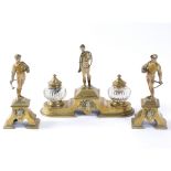A LATE 19TH CENTURY BRASS AND COLD PAINTED THREE PIECE DESK INKWELL SET with a jockey, figures and
