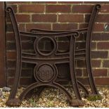 A PAIR OF 'STREET MASTER' CAST IRON BENCH ENDS each with a roundel bearing the date 1991 and each