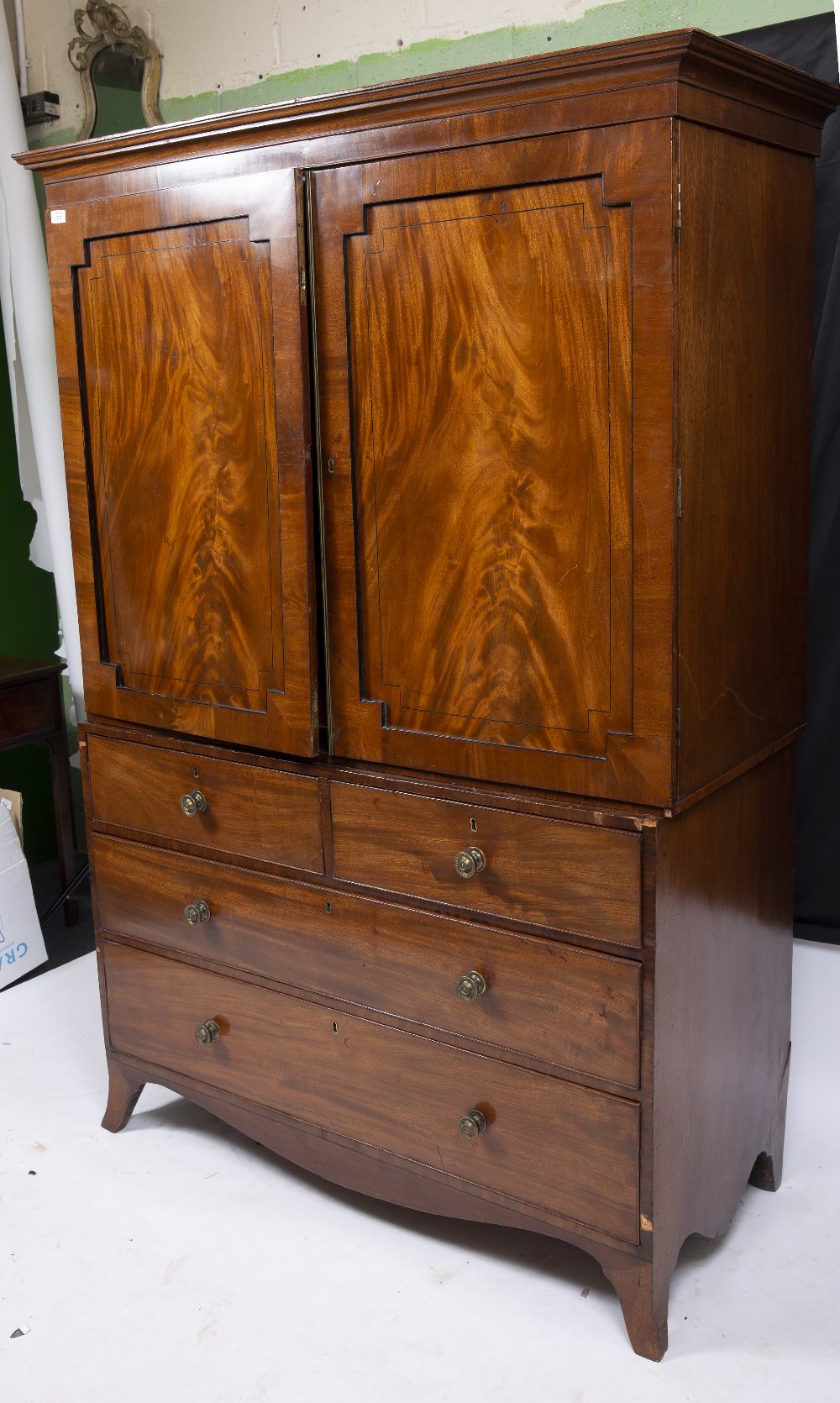 A 19TH CENTURY MAHOGANY LINEN PRESS with twin panelled doors above two short and two long drawers - Image 9 of 10