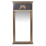 A PARCEL GILT BLACK PAINTED PIER MIRROR with decorative moulding, fluted pilasters with mark