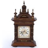 AN EARLY 20TH CENTURY STRIKING MANTLE CLOCK with an architectural case, a painted dial with roman