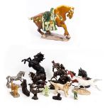 A TANG STYLE CHINESE POTTERY HORSE 55cm long x 41cm high together with further resin models and a