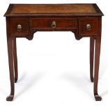 A GEORGE II MAHOGANY SIDE TABLE with later leather inset top and three drawers standing on square
