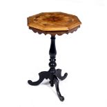 AN ANTIQUE OCTAGONAL SPECIMEN WOOD OCCASIONAL TABLE with ebonised turned column support and tripod