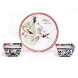 A CHINESE PORCELAIN PLATE decorated with birds in branches within a geometric border, 23.5cm