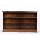 A GEORGIAN STYLE MAHOGANY BOOKCASE with fixed shelves and standing on plinth base, 180.5cm wide x