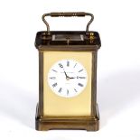 A LATE 20TH CENTURY BRASS CARRIAGE CLOCK by Matthew Norman of London, the circular enamel dial