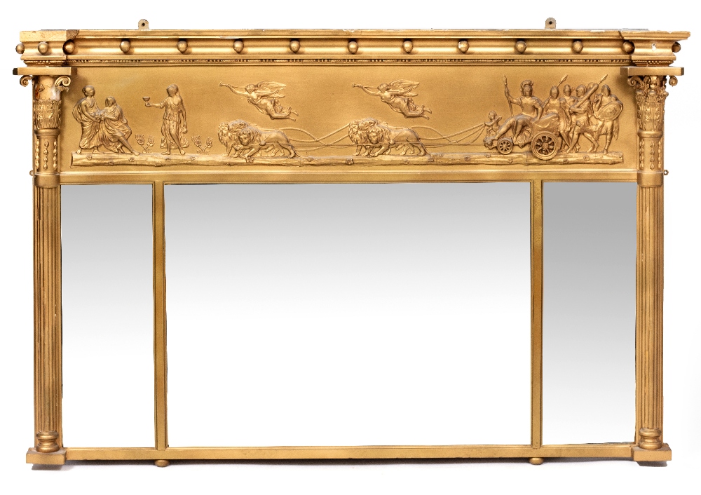 A REGENCY STYLE GILT OVER MANTLE MIRROR with panel depicting a Roman chariot drawn by six lions, the