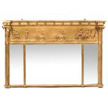 A REGENCY STYLE GILT OVER MANTLE MIRROR with panel depicting a Roman chariot drawn by six lions, the