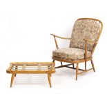AN ERCOL LIGHT ELM SPINDLE BACK ARMCHAIR 70cm wide x 68cm deep x 90cm high with a matching footstool