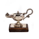 A VICTORIAN TABLE LIGHTER in the form of an oil lamp with a pineapple finial, serpent handle and
