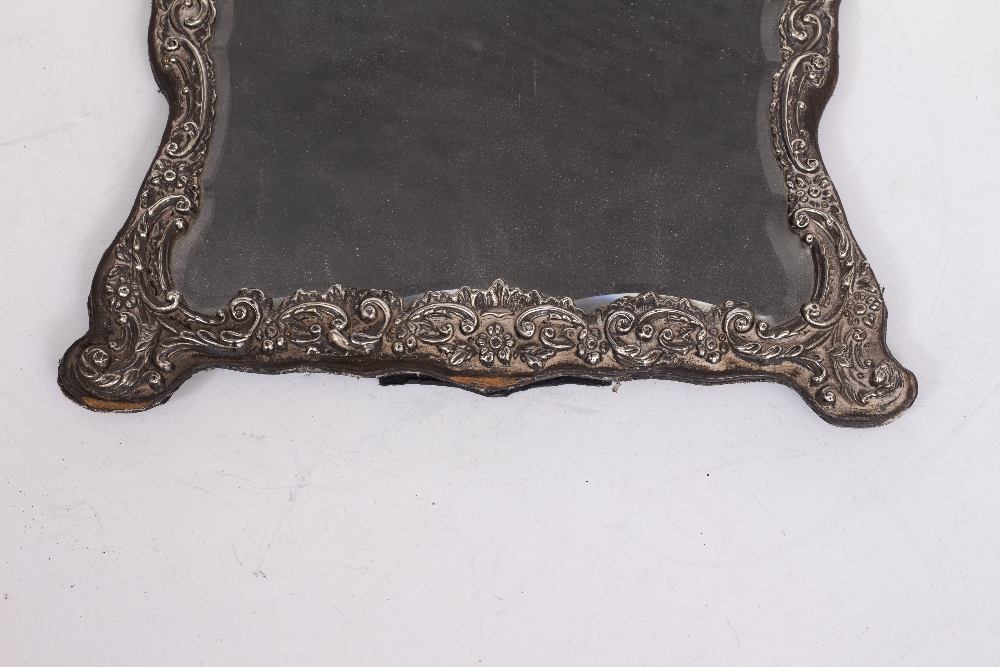 A VICTORIAN EMBOSSED SILVER MOUNTED DRESSING TABLE MIRROR with shaped and bevelled glass, 34cm - Image 2 of 4