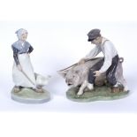 TWO ROYAL COPENHAGEN PORCELAIN FIGURINES a boy and a pig, and a girl with a goose, numbered 848,
