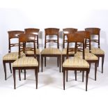 A SET OF EIGHT 19TH CENTURY BIEDERMEIER STYLE DINING CHAIRS with narrow backs, pierced horizontal