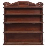 A VICTORIAN MAHOGANY WATERFALL BOOKCASE with a top of scrolls either side of a central panel, four